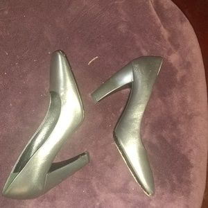 Grey Prada medium heel pump with square toe